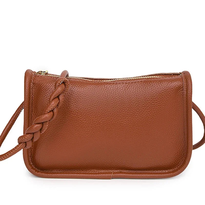 Genuine cowhide leather crossbody handbag for women, high-capacity shoulder purse, stylish and durable fashion accessory.