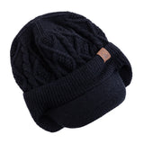 Unisex winter hat with plush fur lining, earflaps, and thick knitted beanie design for outdoor sports