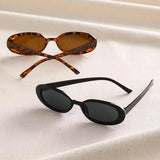 Vintage oval sunglasses for women by HSF Marketplace featuring black and red retro design with small oval lenses.