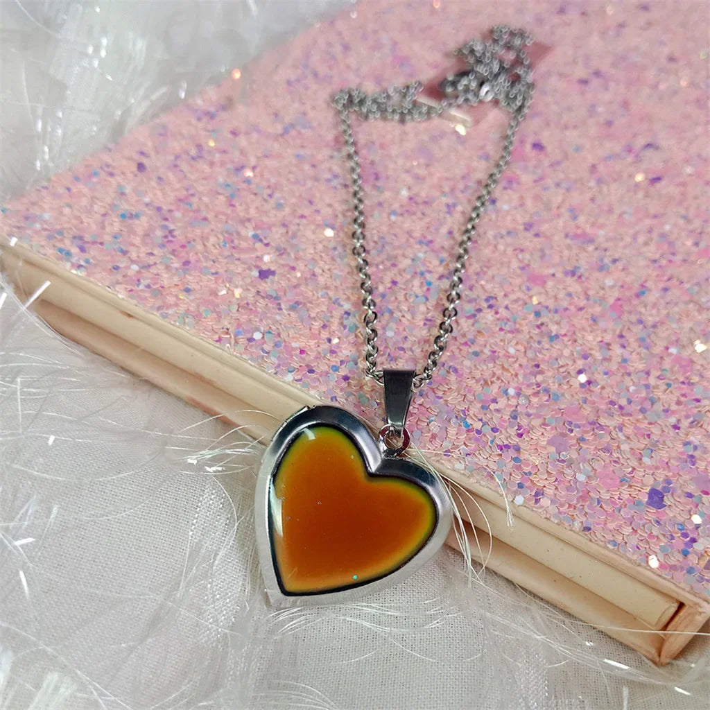 Heart-shaped mood locket necklace by HSF Marketplace with color-changing stainless steel, photo pendant, and love design jewelry.