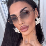 Rimless polygon sunglasses for women with gradient lenses, metal and bamboo temple frames, luxury vintage designer sun glasses.