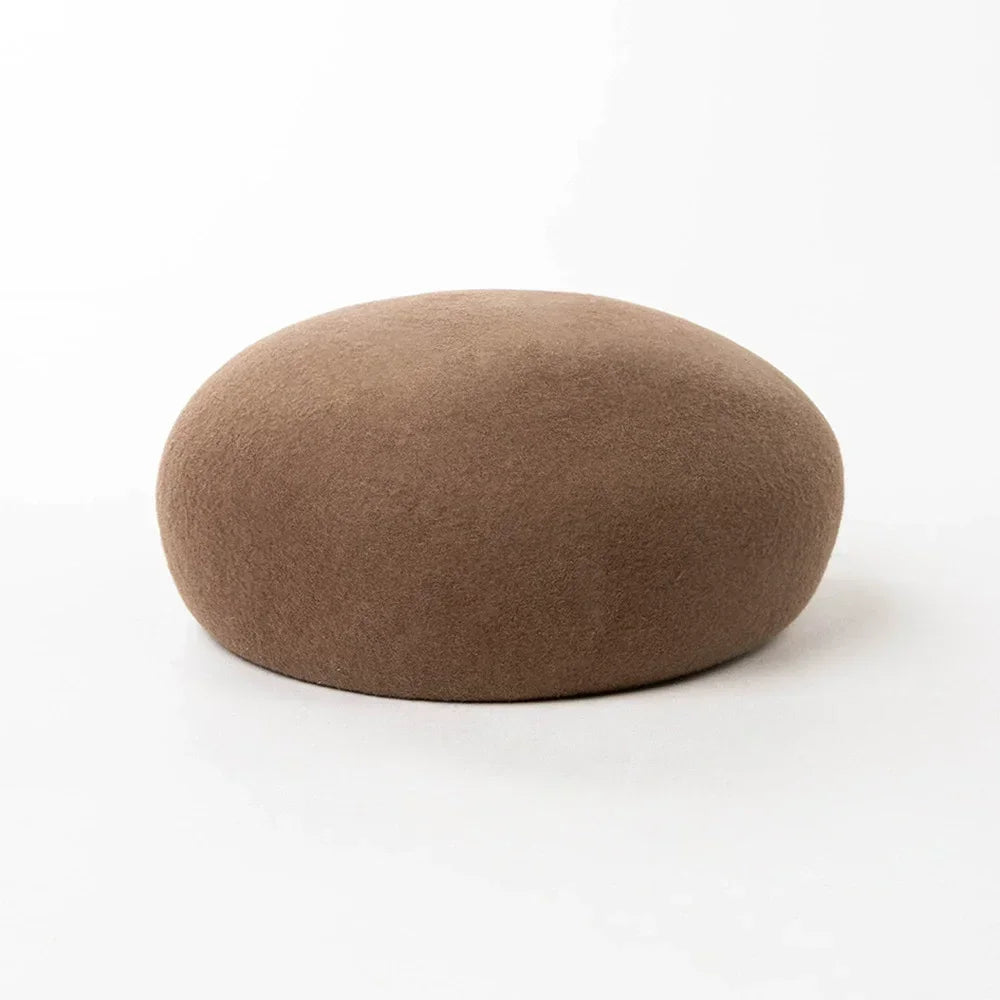 Women's vintage wool felt beret hat with hard concave top, pillbox design, and fascinator styling