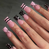 24-piece pink and black French polka dot striped long coffin press-on false nails by HSF Marketplace