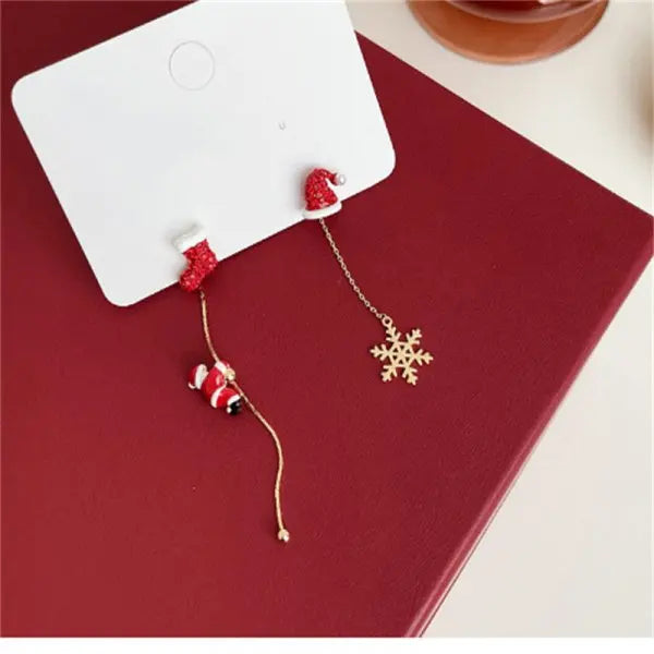 Moving Santa Claus tassel dangle earrings by HSF Marketplace for festive style