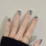 24-piece cute girly short square false nails with white French tips, glitter stars, rhinestones, bows and cat-eye accents