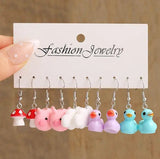 Cute cartoon duck dangle earrings set by HSF, featuring playful yellow duck charms for trendy girls