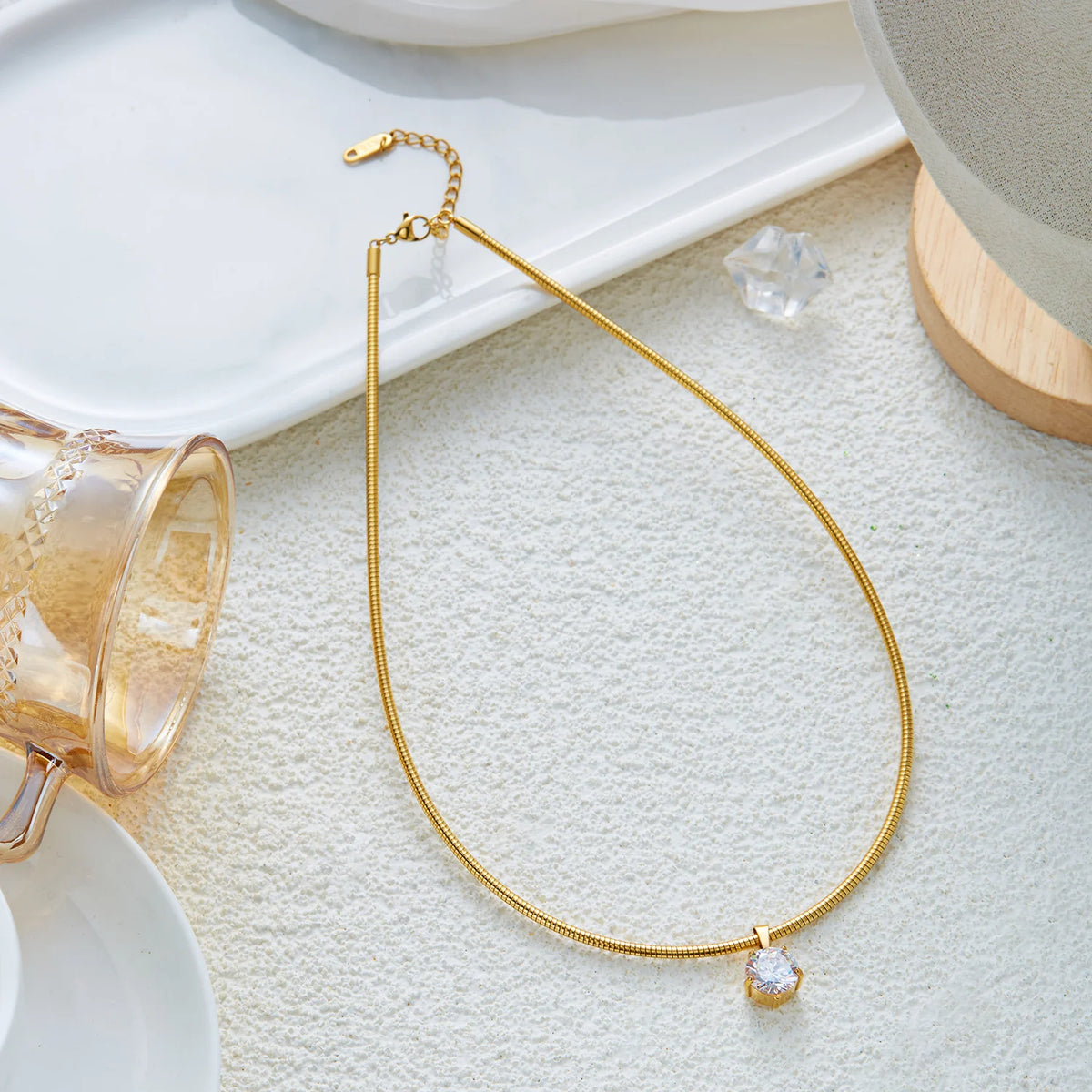 Gold-plated stainless steel choker necklace with cubic zirconia accents for women, waterproof and ideal for daily or party wear.