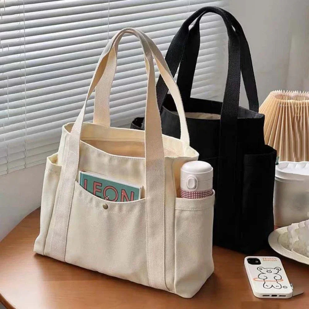 Large capacity canvas tote bag by HSF Marketplace, stylish shoulder bag for work, college, or commuting with spacious interior.