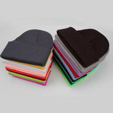 Unisex soft knitted winter beanie hat in a solid color, available in 24 colors