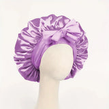 Silk satin sleep bonnet with adjustable tie band, designed for women and men to protect hair overnight.