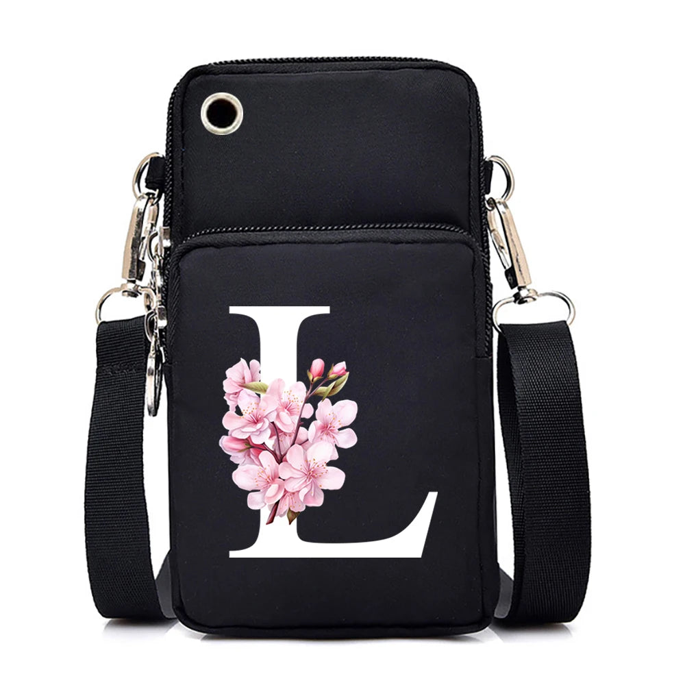 Hsf Marketplace small crossbody handbag with floral Sakura alphabet graphics, featuring a mobile phone pocket and adjustable strap.