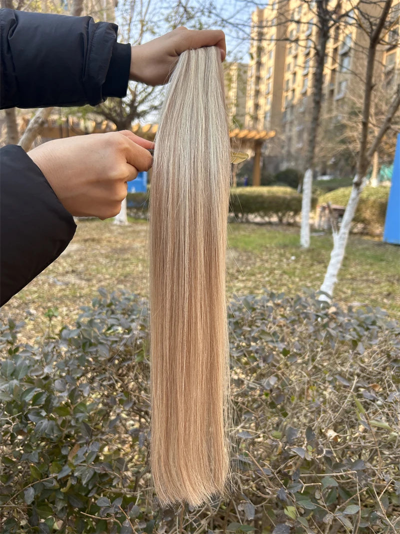 Wrap-around human hair ponytail extension in natural blonde, 60g or 100g, shown from the side