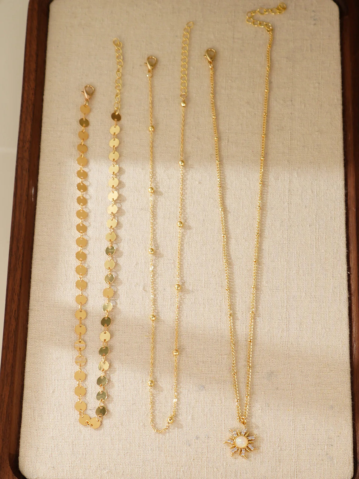 Three-piece delicate sun pendant necklace set for women, layered gold-tone jewelry by HSF Marketplace