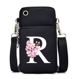 Small floral alphabet crossbody bag for women, HSF Marketplace, with pink and white Sakura letter graphics and mobile phone compartment.
