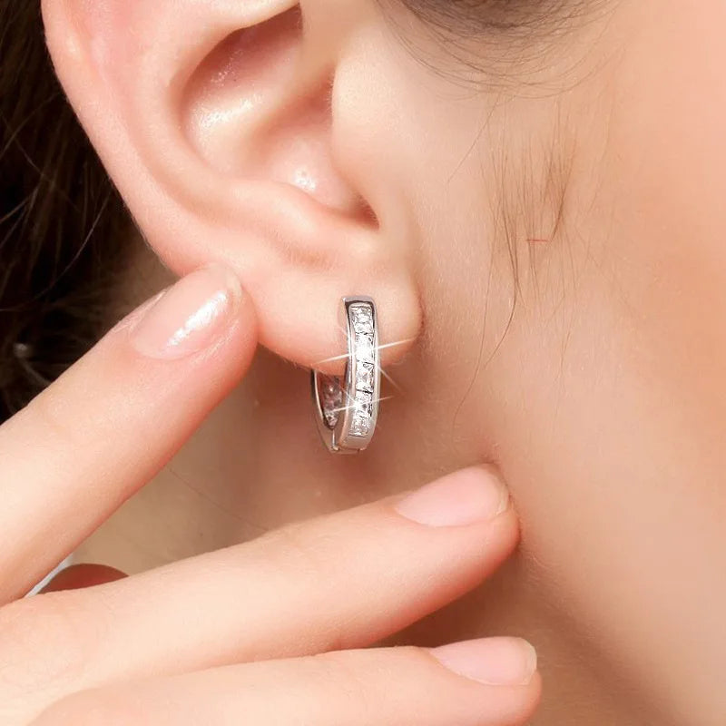 Elegant 925 sterling silver zircon earrings for women, featuring sparkling stones and a polished finish