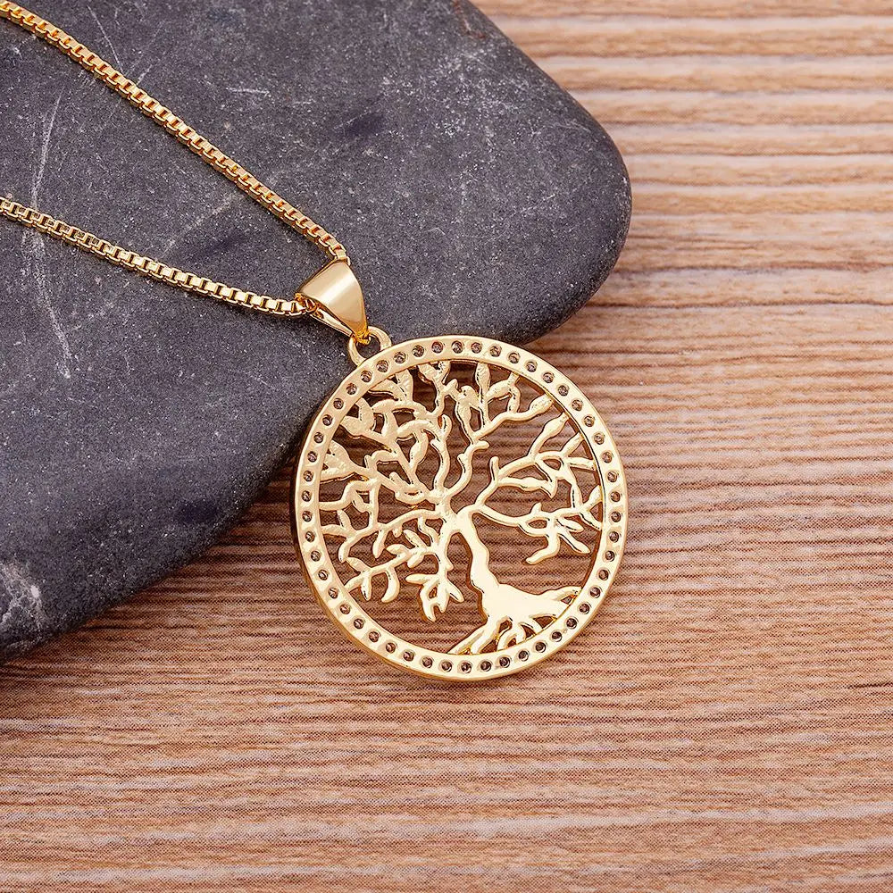 Gold plated Tree of Life pendant necklace with crystal accents, featuring a zircon chain, stylish jewelry for women.