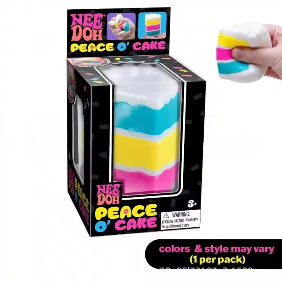 Colorful NeeDoh Piece O' Cake squishy toy from HSF Marketplace, layered rainbow cake design for sensory play and stress relief.