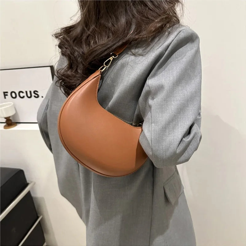 Luxury moon-shaped women's handbag by HSF Marketplace featuring a high-end, elegant single shoulder design and stylish hand-held look.