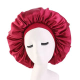 Satin bonnet sleep cap for curly hair by HSF Marketplace, shown in a smooth satin design