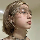 Y2K rimless sunglasses for women with snake-ray metal arms, gradient lenses, wrap-around style, trendy punk-inspired eyewear
