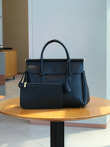 Vintage women's handbag by HSF Marketplace featuring a soft leather flap design, ideal for office and daily commute.