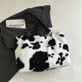 Large cow-print plush women's shopper tote bag with shoulder strap, ideal for winter travel and everyday use.