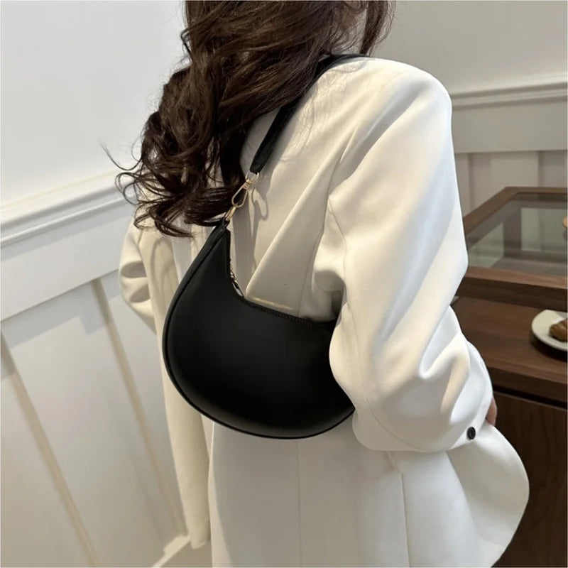 Luxury moon-shaped women's handbag by HSF Marketplace, elegant high-end single shoulder purse with stylish design and premium details.