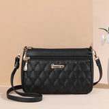 PU leather crossbody handbag with zipper, embroidery thread accents, spacious interior, stylish shoulder bag for women.