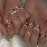 24-piece pink almond false nails with bowknot, love heart, and pearl designs, detachable Korean press-on tips