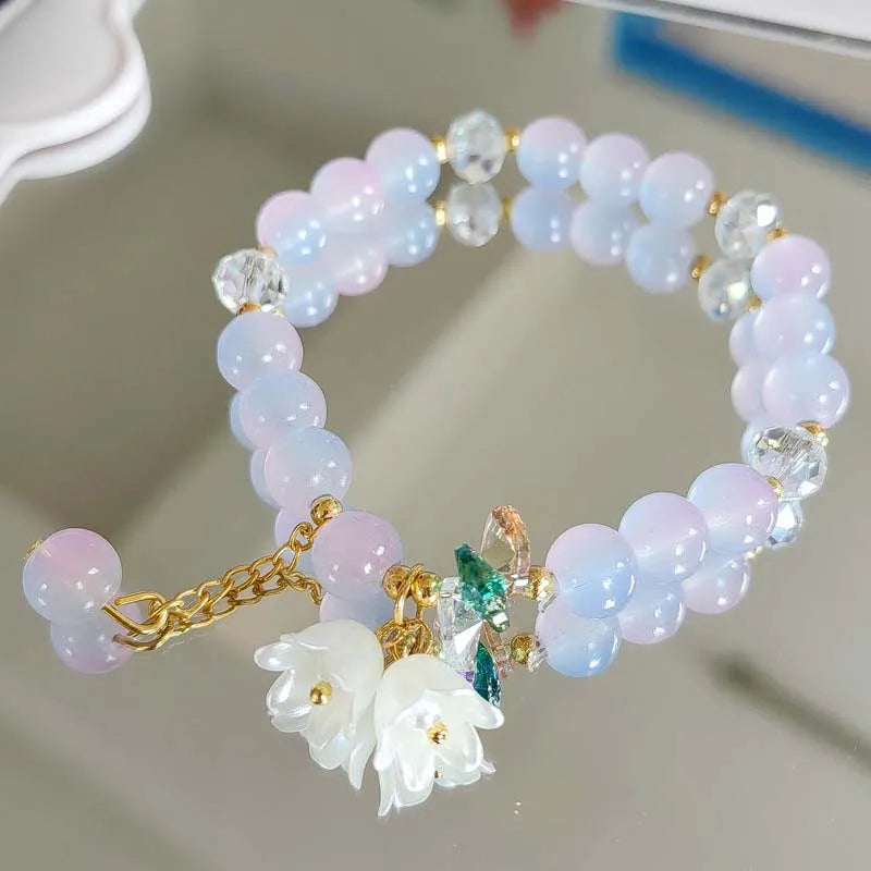 Colorful Lily Valley Flower bracelet for women featuring crystal stones and beads, elastic design for wedding or birthday jewelry.