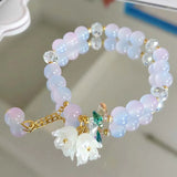 Colorful Lily Valley Flower bracelet for women featuring crystal stones and beads, elastic design for wedding or birthday jewelry.