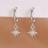 Stainless steel star dangle earrings with sparkling zircons by HSF Marketplace