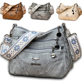 Vintage leather women's shoulder purse with multi-pocket design and ethnic pattern strap, ideal for everyday use.