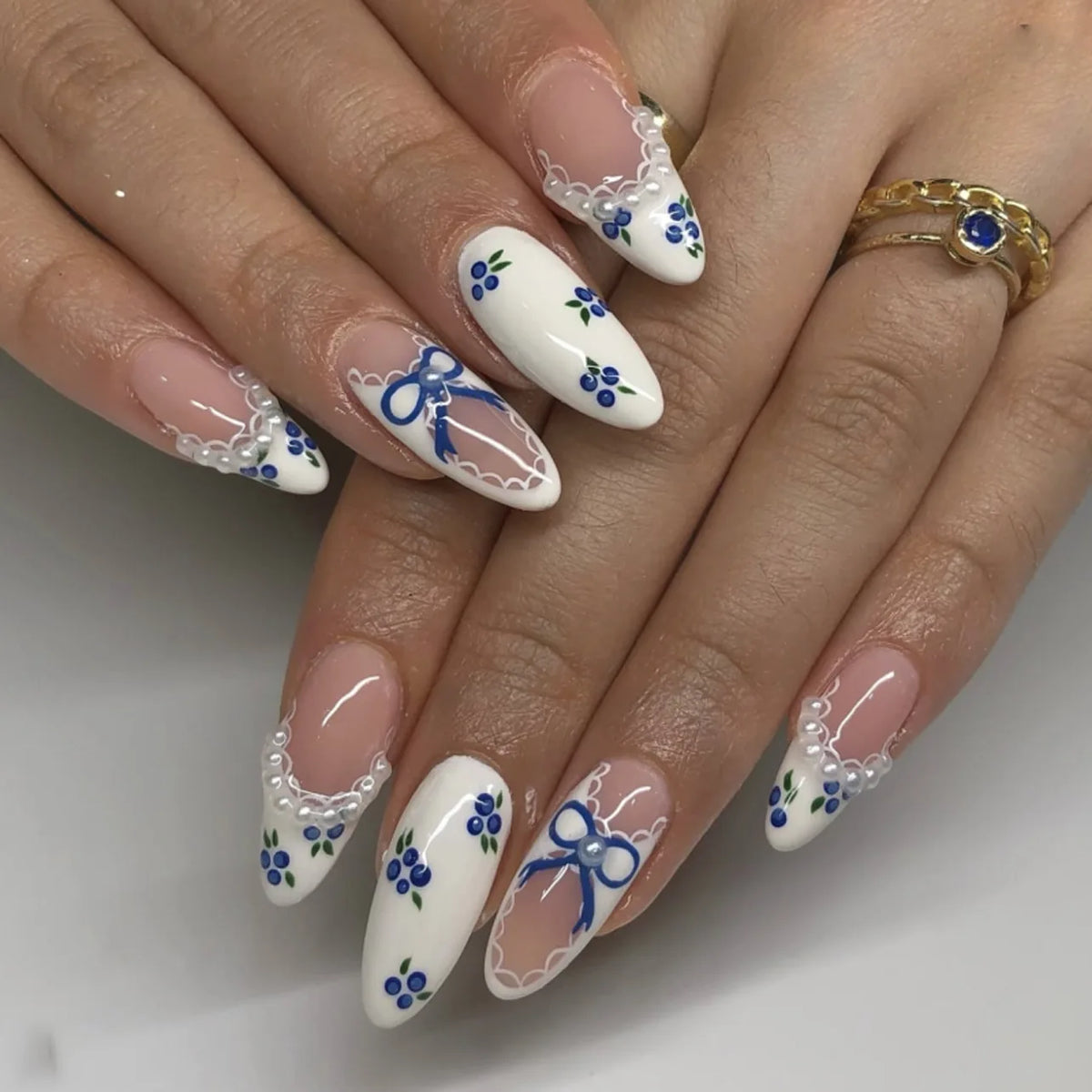 Pink almond press-on false nails with bowknots, love hearts, and pearl designs, 24-piece detachable set