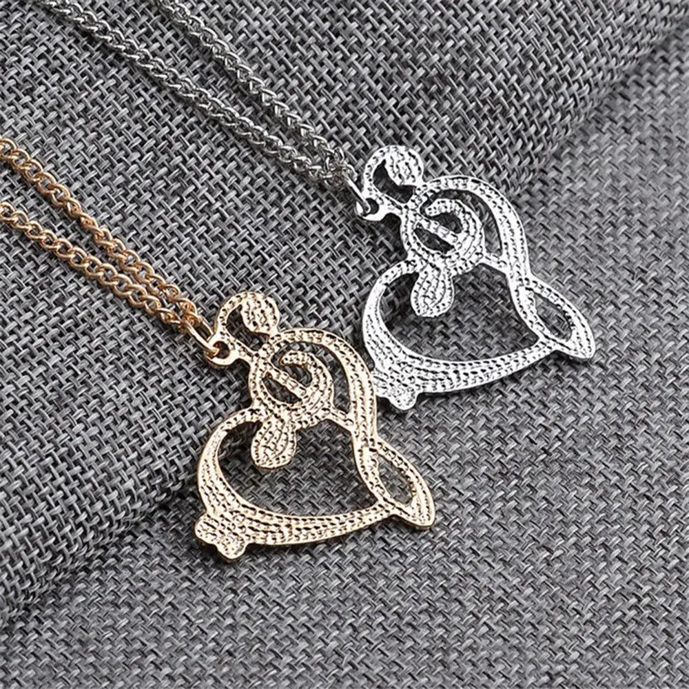 Stainless steel music note heart necklace featuring treble and bass clef charms, infinity love pendant, ideal for women.