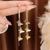 Trendy flower drop earrings with long tassels and rhinestones by HSF Marketplace