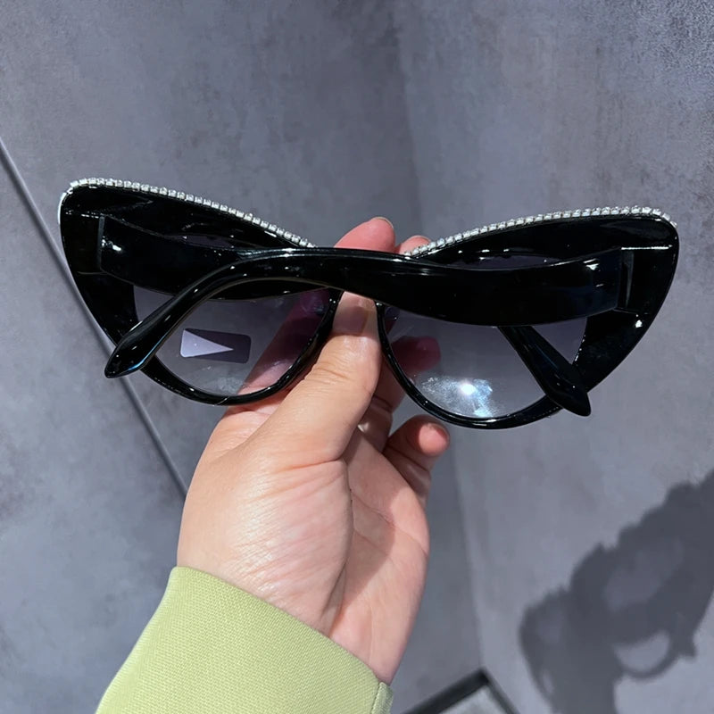 Oversized cat eye sunglasses for women by HSF Marketplace with luxury crystal accents and retro style, featuring bold black frames.