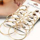 Set of 12 pairs of HSF Marketplace punk hoop earrings with large round and oversized circle designs for women and girls.