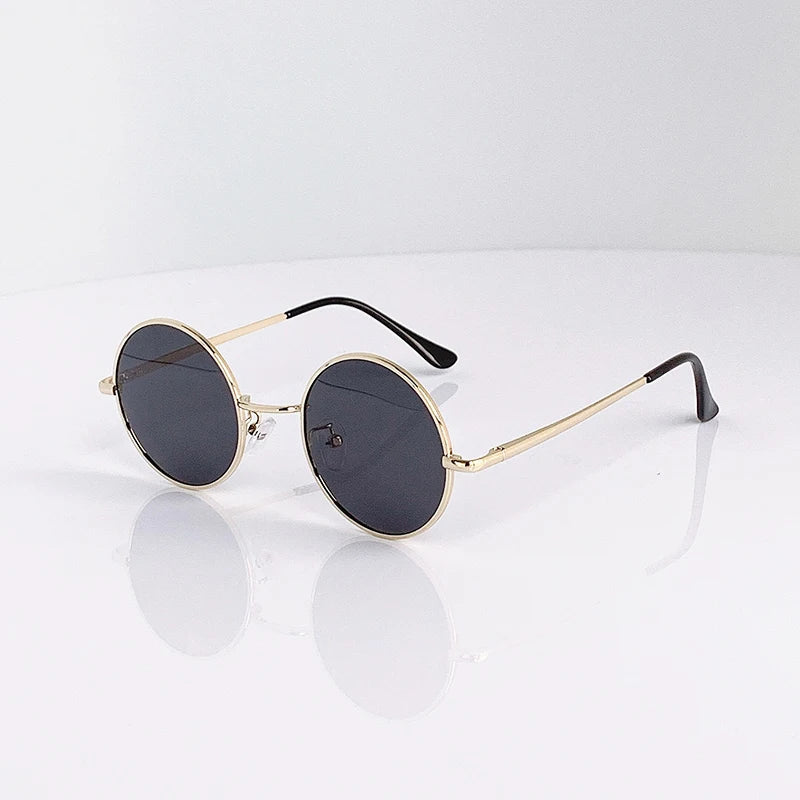 Retro vintage round polarized sunglasses for men and women with black lenses, alloy metal frame, UV400 protection by HSF Marketplace.