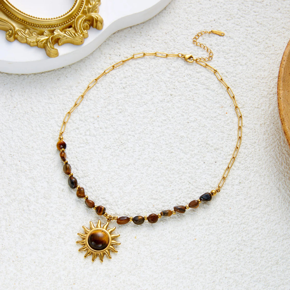 Gold PVD stainless steel tiger eye sun necklace for women, featuring a pendant on a choker chain, waterproof and tarnish-free jewelry.