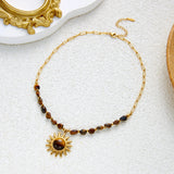 Gold PVD stainless steel tiger eye sun necklace for women, featuring a pendant on a choker chain, waterproof and tarnish-free jewelry.