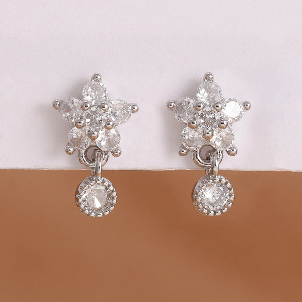 Stainless steel star dangle earrings with sparkling zircon accents by HSF Marketplace