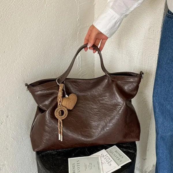 Luxury PU leather handbag for women with spacious design, shoulder and crossbody style, ideal for commuting and office use.