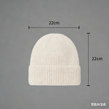 Warm knitted melon hat, unisex winter beanie in soft textured knit, shown in a classic rounded style