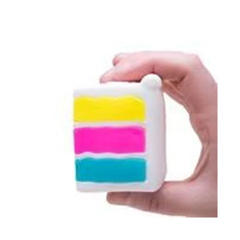 Colorful layered rainbow NeeDoh Piece O' Cake squishy toy from HSF Marketplace, a fun sensory fidget stress relief toy.
