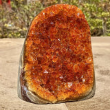 Orange quartz crystal cluster from HSF Marketplace, natural mineral rock with vibrant orange color, ideal for home or office decor.