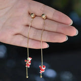 Moving Santa Claus tassel dangle earrings by HSF Marketplace for festive style
