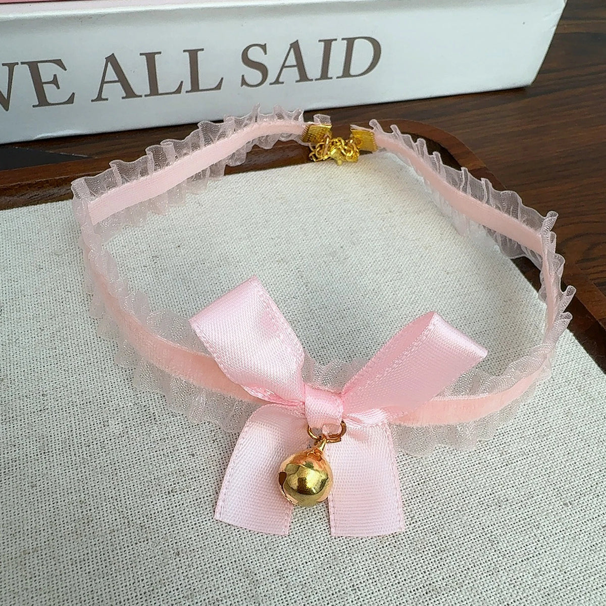 Cute women's lace choker necklace with bow, small bell pendant, gothic style jewelry, perfect for a stylish and elegant look.