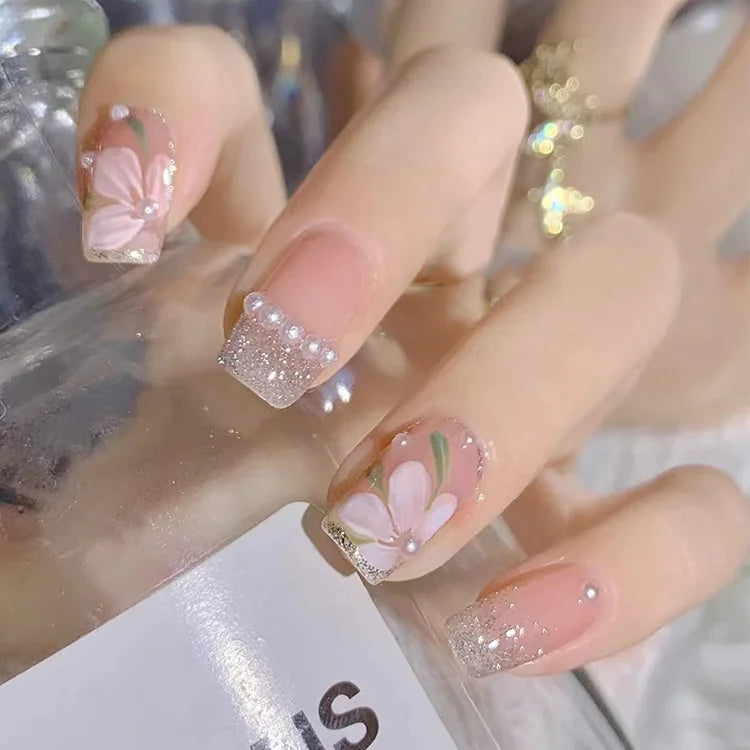 24-piece cute girly short square false nails with white French tips, glitter stars, rhinestones, bows, and cat-eye accents