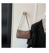 Ladies bow design underarm shoulder handbag, stylish fashion purse for women, ideal for commute and casual use.